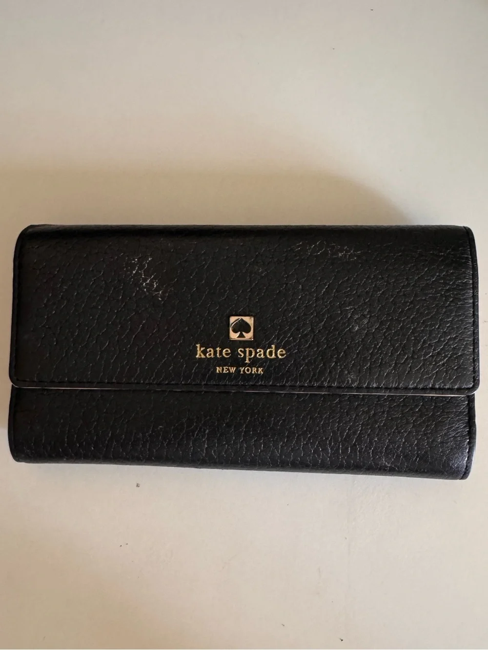kate spade Black Pebbled Leather Fold Wallet with Gold Logo